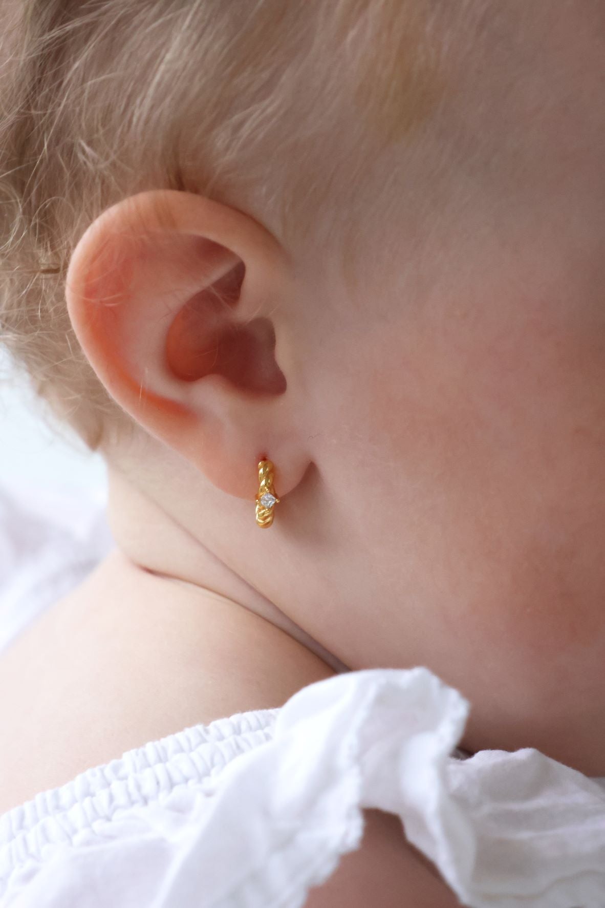 baby with earring